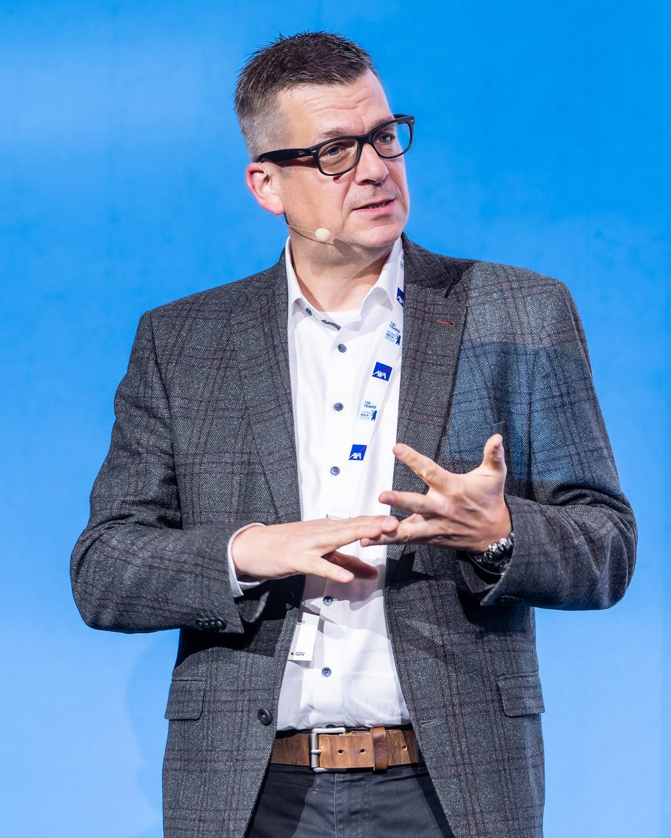 Ken Rohlmann speaking at the IUMI 2024 conference in Berlin